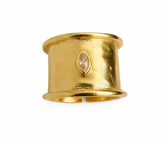 A gold-plated band with a marquise-cut clear cubic zircon set in the center, shown on a plain white background