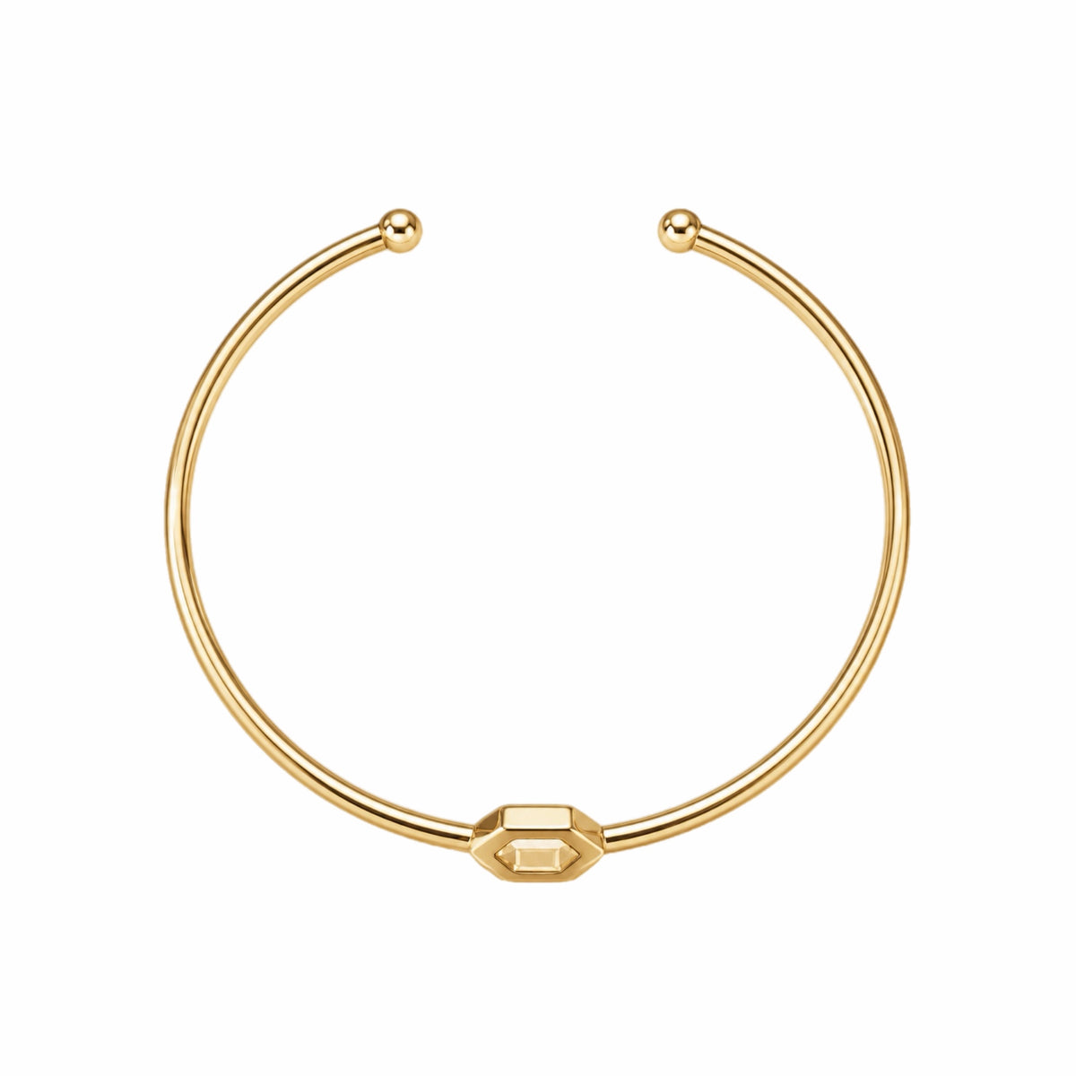 A gold-plated brass cuff bracelet with a central open hexagon design shown in aerial view on a plain white background.