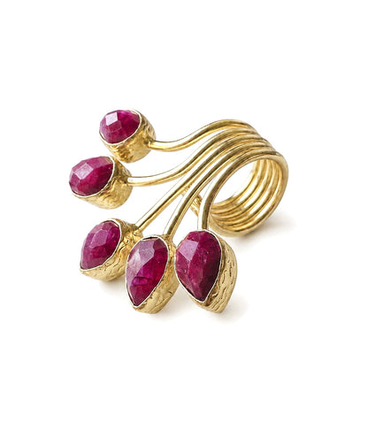 A gold-plated multi-stone ruby ring featuring five faceted deep pinkish-red teardrop gemstones set in fan design