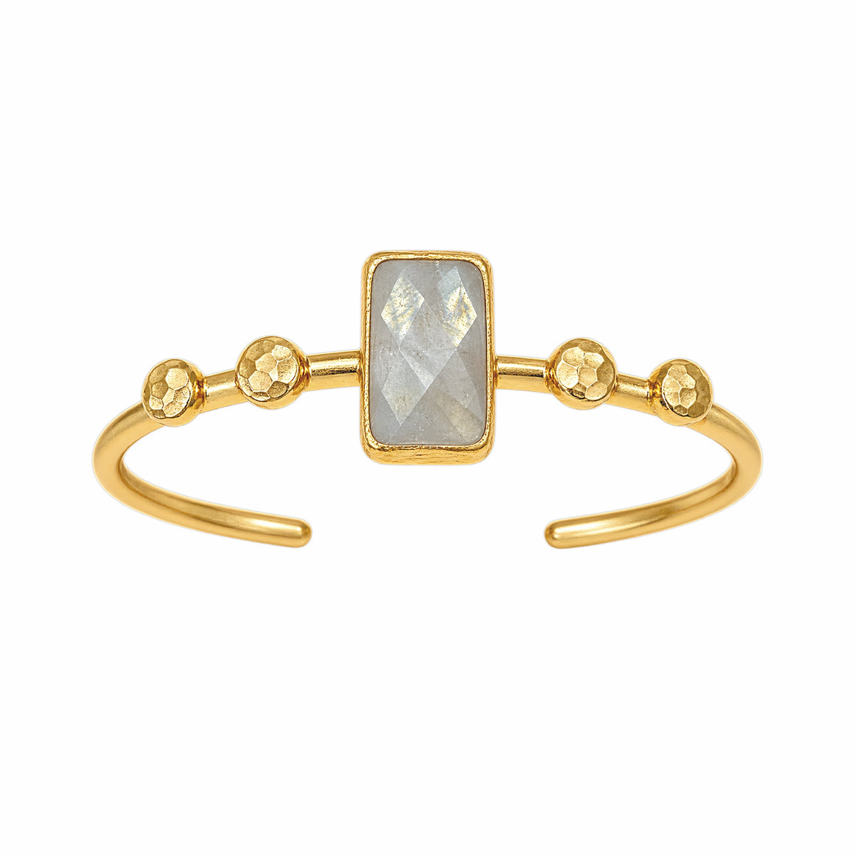 Gold cuff bracelet featuring a rectangular faceted light gray labradorite gemstone in the center and four textured gold ball accents on each side of the stone, set on a white background.