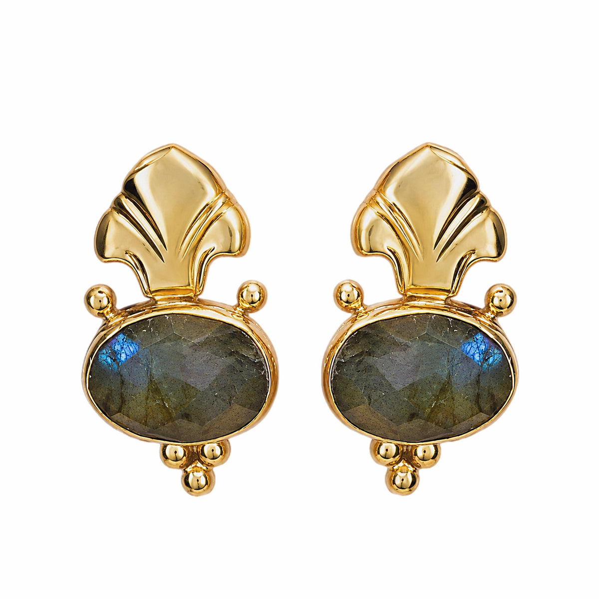 A pair of Fleur de lis gold stud earrings featuring oval labradorite stones in gray green, on a plain white background.