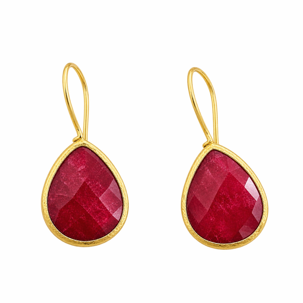 A pair of gold and faceted red ruby teardrop drop earrings on a plain white background.