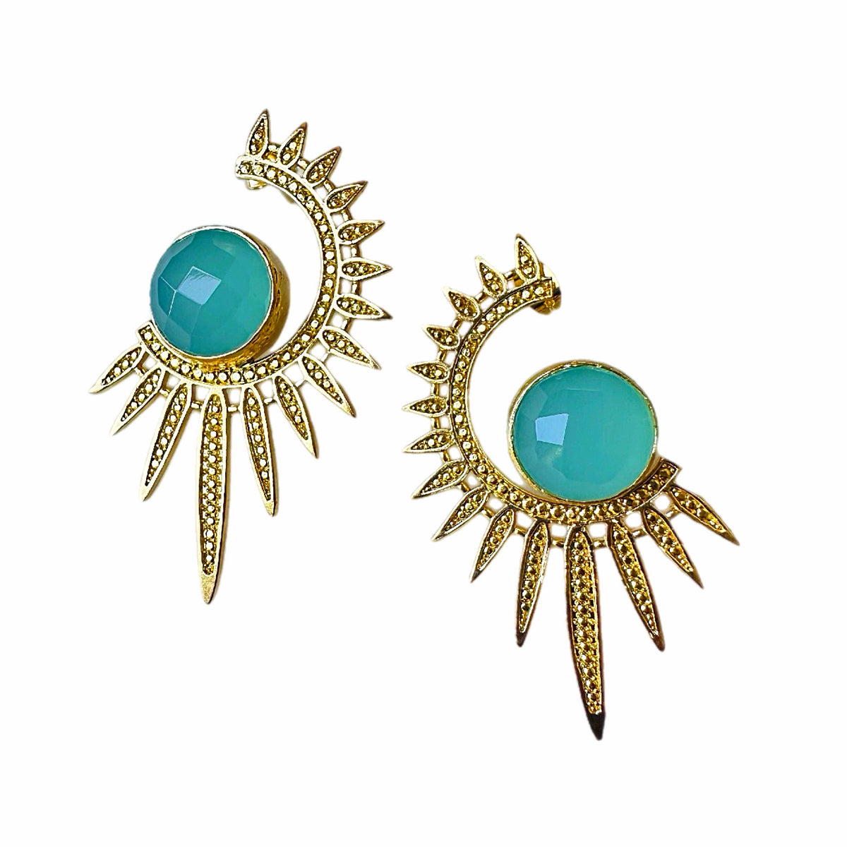 A pair of gold crescent moon and sunburst stud earrings with faceted aqua chalcedony gemstones, shown on a white background.