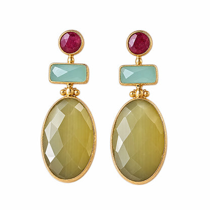 A pair of gold drop earrings featuring a round ruby gemstone, a rectangular aqua chalcedony stone, and a large faceted oval yellow agate stone, shown on a plain white background.