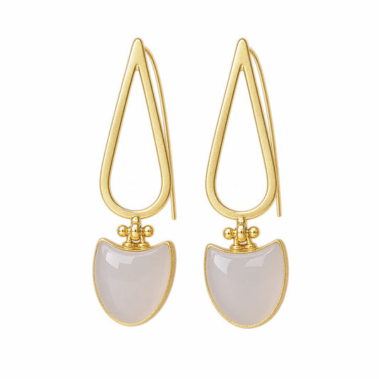 A pair of gold drop earrings featuring a teardrop-shaped openwork gold frame and a curved, dome-shaped snow Quartz stone dangle, set against a plain white background.