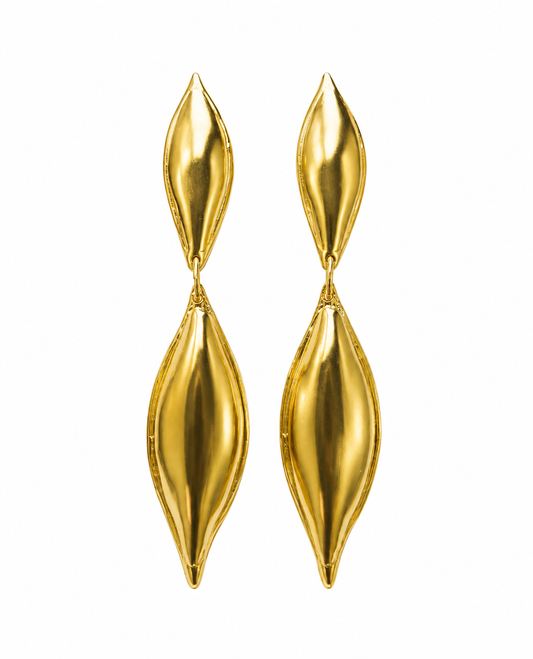A pair of contemporary gold-plated long gold dangle earrings displayed against a solid white background