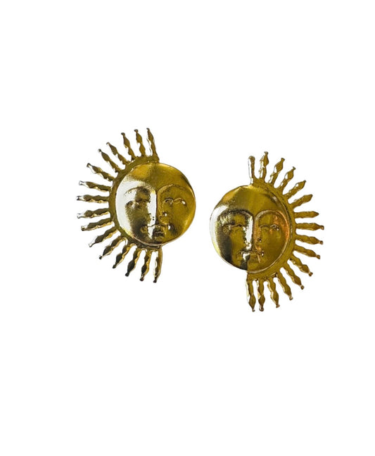 A pair of gold-plated sun stud earrings against a white background.