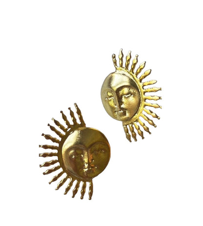 A pair of gold-plated sun face stud earrings on a plain white background.