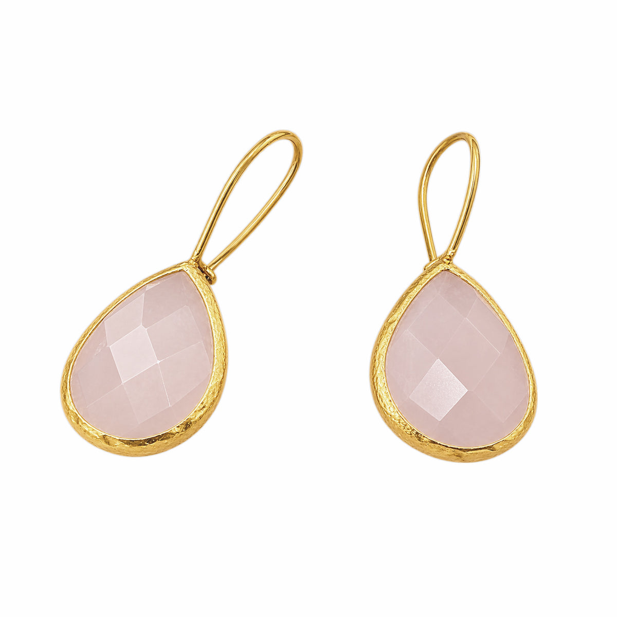 A pair of gold teardrop earrings featuring faceted light pink rose quartz gemstones in textured gold bezels, set against a plain white background.