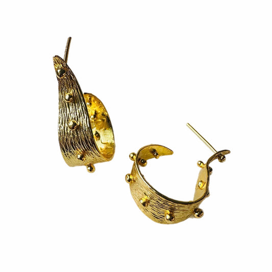 A pair of textured contemporary gold hoop earrings with small raised gold ball accents, on a plain white background.