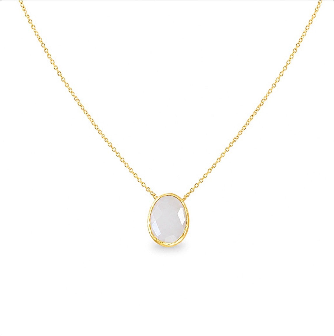 A zoomed out view of minimal gold faceted snow Quartz pendant necklace on a white background 