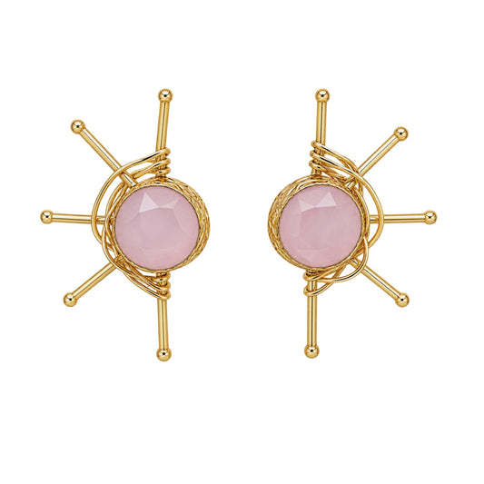 A pair of gold-plated geometric stud earrings with a faceted pale pink rose quartz round stone on a white background.
