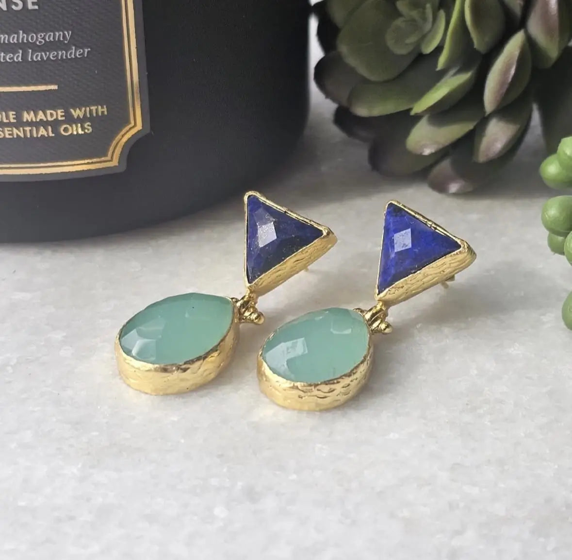 Elegant artisanal sustainable gold-plated anqua chalcedony and lapis lazuli earrings with textured surface.