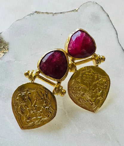 Beautiful artisanal Gold-plated ruby stud  earrings with etchings on a white stone background