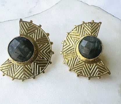 Handmade sustainable gold-plated bold pair of statement stud earrings with labradorite on a white surface