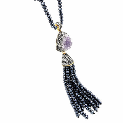 Elegant handmade Turkish Necklace with blue beaded tassel and druzy pendant with cz on a white background