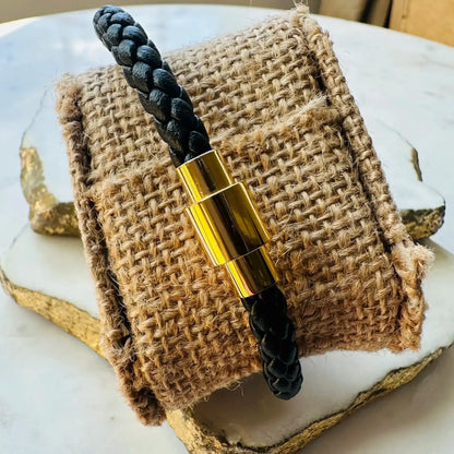 Back of Handmade braided black Bracelet with woven cord and gold clasp