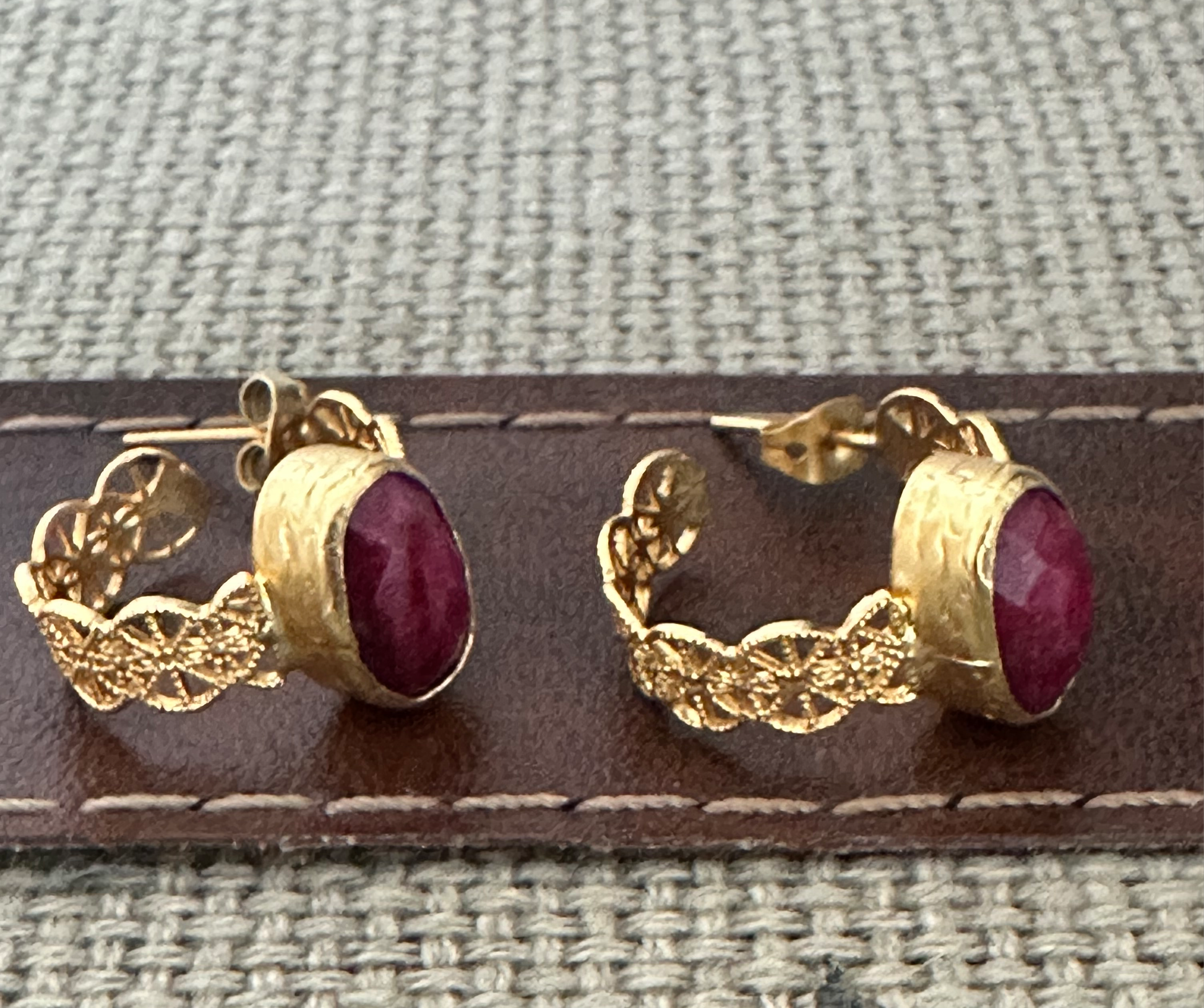 Handmade sustainable gold-plated lace ruby hoop earrings facing right 