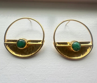 A pair of gold-plated hammer-finished half disc earrings with green jade accents, displayed against a white background