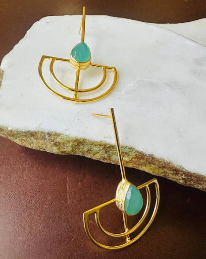 Gold-plated artisanal contemporary aqua chalcedony earrings on stone surface