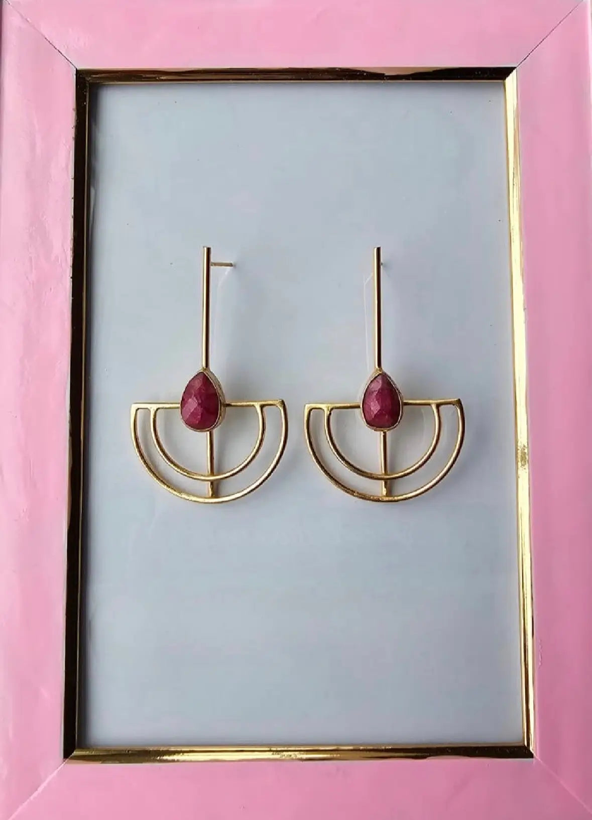 Gold-plated sustainable contemporary earrings with ruby gemstones in a pink frame