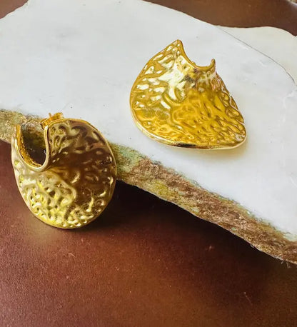 Handmade contemporary eco-friendly gold-plated bold statement earrings on marble