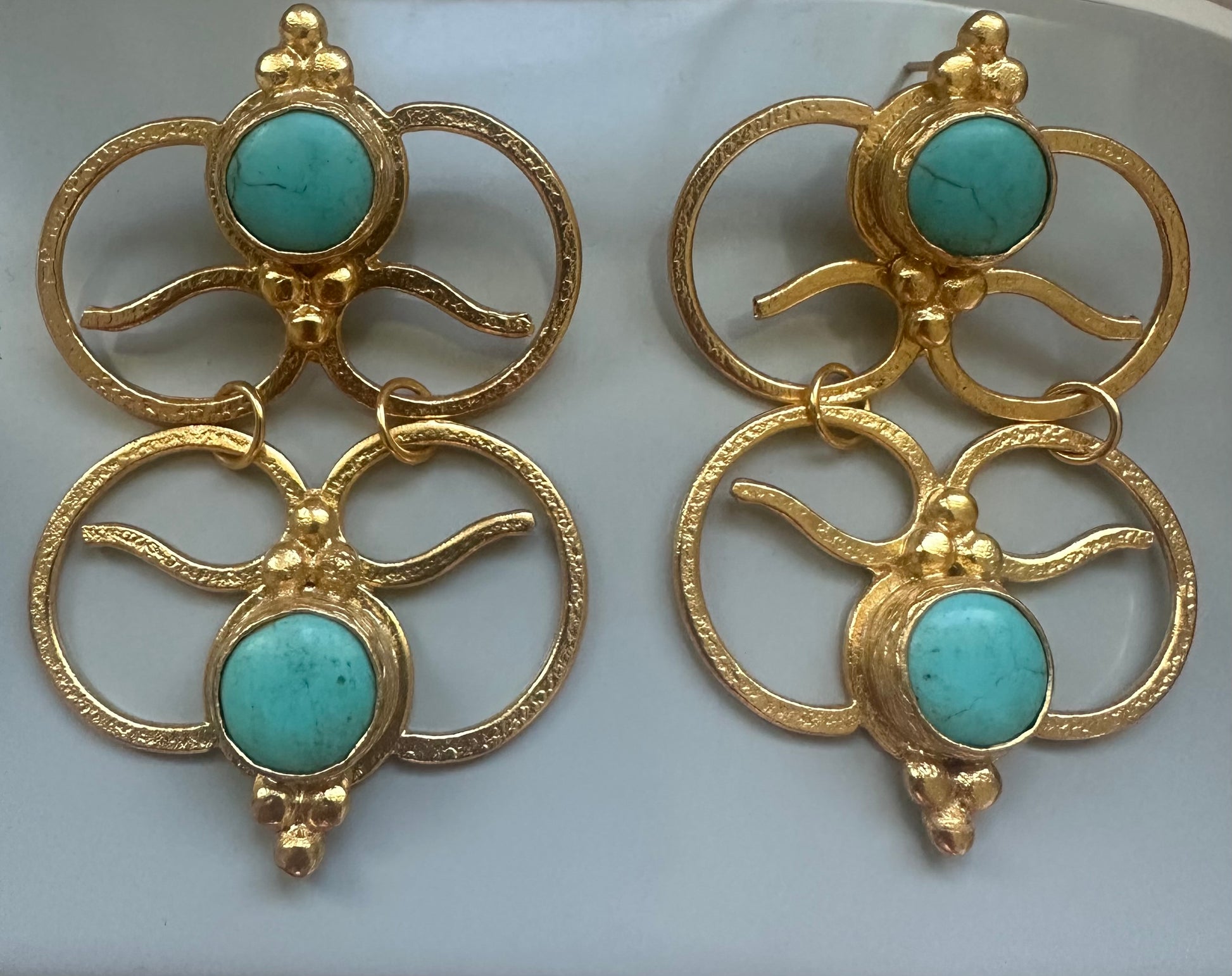 Handmade sustainable gold-plated bold dangle earrings with abstract geometric design and round turquoise gemstones at the center