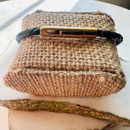 Handmade dainty men’s braided black leather bracelet with a sleek gold clasp 