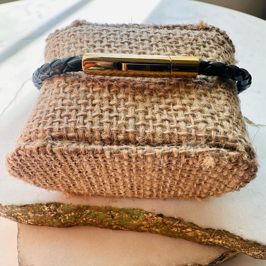 Handmade dainty men’s braided black leather bracelet with a sleek gold clasp 