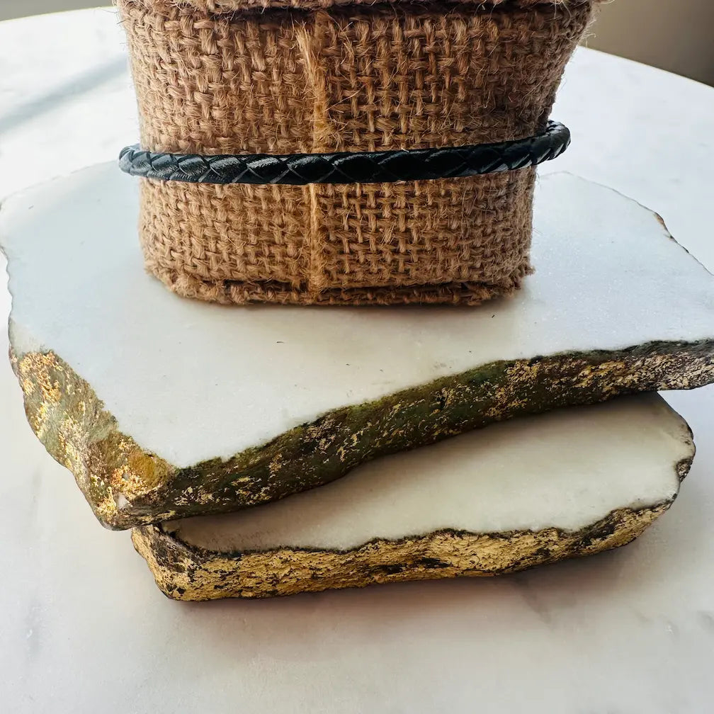 Back of handmade black thin woven bracelet 