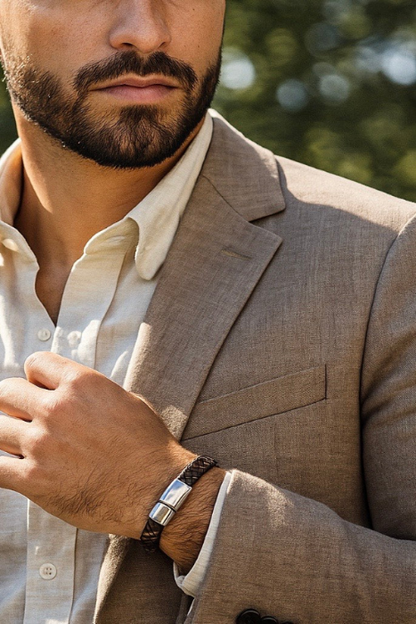 Close-up-of-man-in-linen-suit-with-bohemian-wearing-woven-bracelet-with-silver-hardware