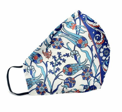 Colorful handmade double-layered Iznik silk face mask on a white background