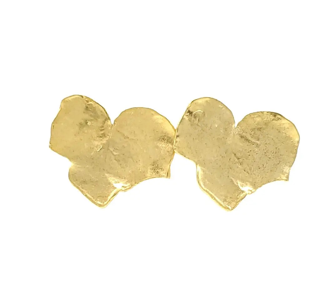 Contemporary handmade sustainable gold-plated bold leaf earrings against white background