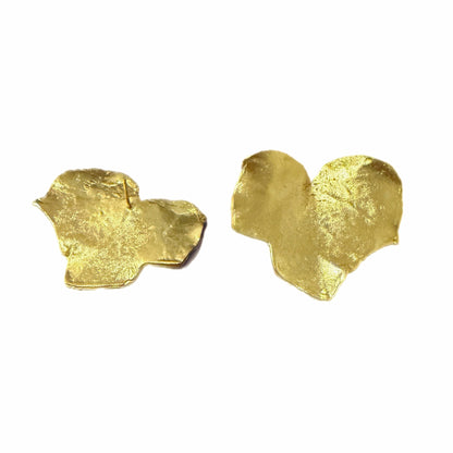 Contemporary handmade bold gold plated leaf stud earrings on white background