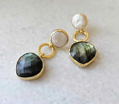 Contemporary artisanal sustainable gold-plated earrings with gold loops, flat pearls and labradorite gemstones on gray background 