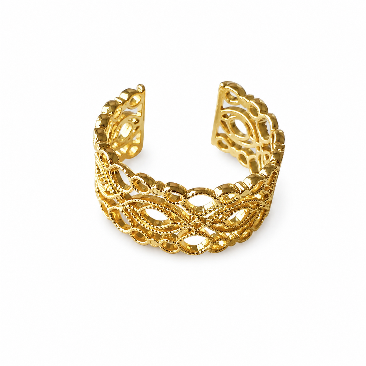 Dainty artisanal gold plated ring on marble surface