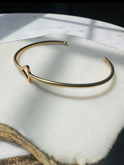 Sustainable Gold-plated dainty bracelet on a marble surface