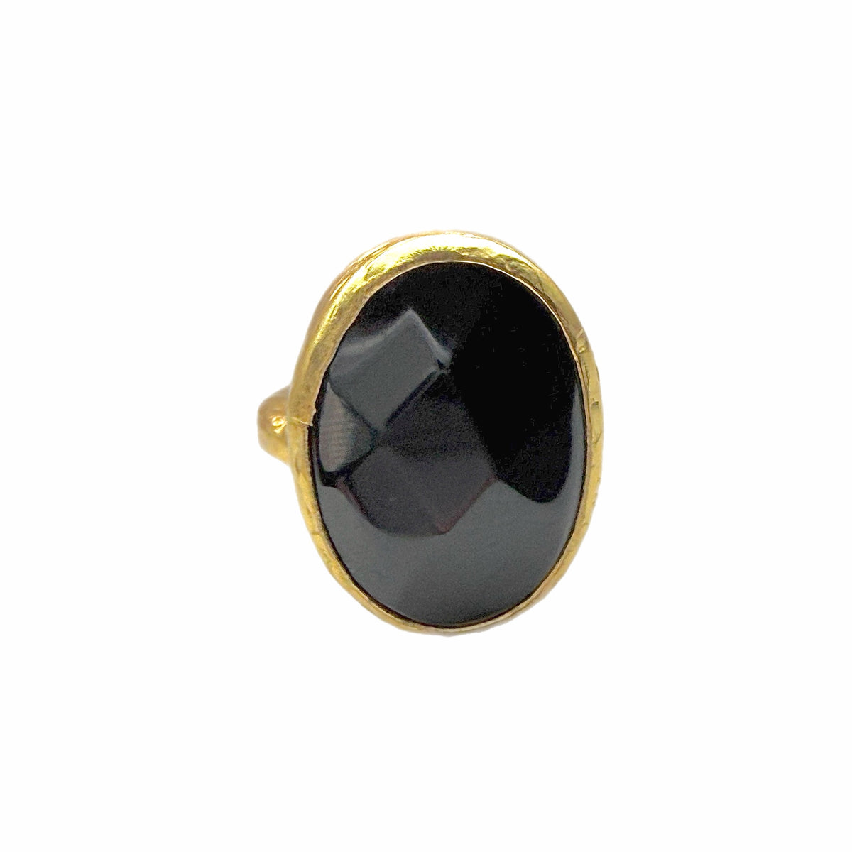 Front view of A textured handmade gold ring featuring a large, faceted onyx gemstone ring against a plain white background
