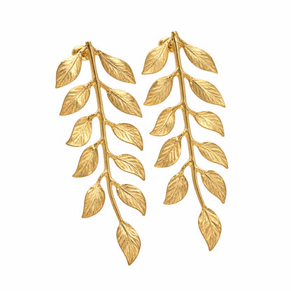 Handmade artisanal gold plated vine leaf earrings facing right on white background by Bebek jewels