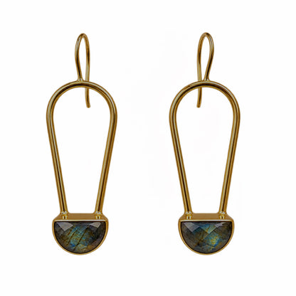 A pair of gold drop earrings with a teardrop-shaped gold frame and a faceted labradorite stone set in a semi-circular gold base, shown on a plain white background.