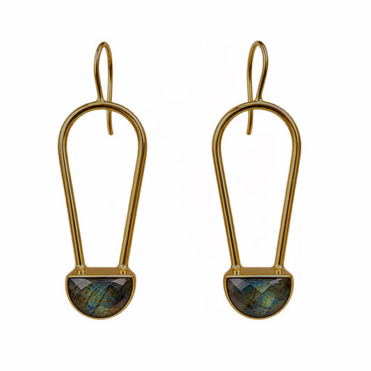 A pair of gold drop earrings with a teardrop-shaped gold frame and a faceted labradorite stone set in a semi-circular gold base, shown on a plain white background.