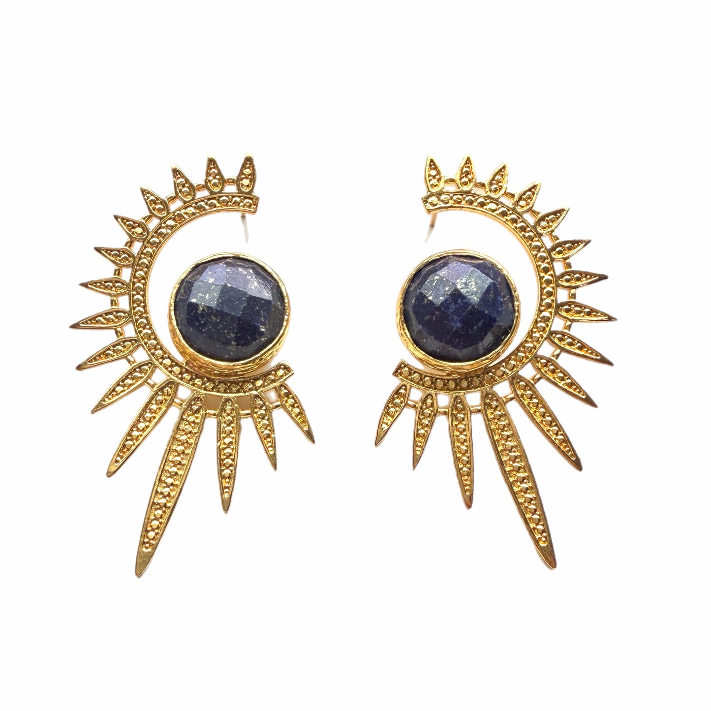 Gold sun-shaped earrings with blue lapis lazuli gemstones on a white background