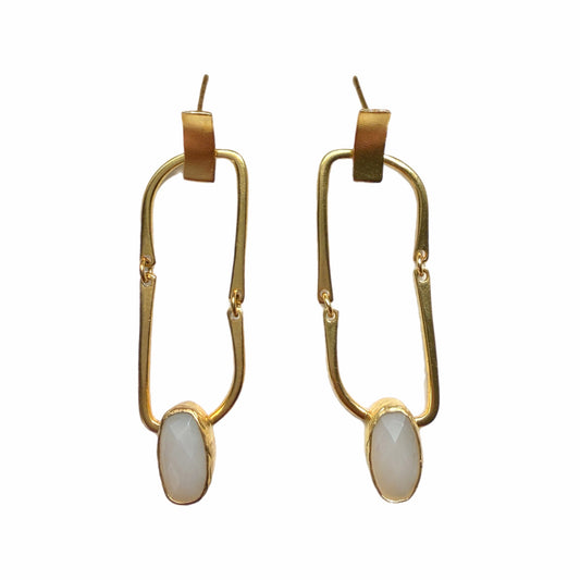Contemporary handmade sustainable gold-plated flexible link dangle earrings with snow Quartz on white background 