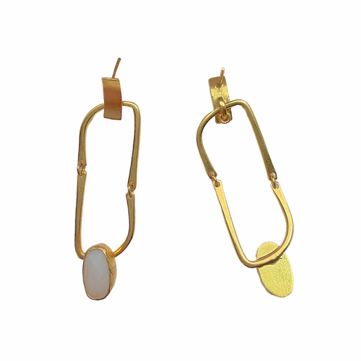 Contemporary handmade sustainable gold-plated flexible link dangle earrings with snow Quartz on white backdrop 