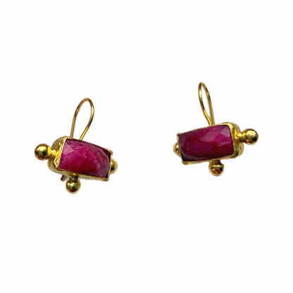 A pair of rectangle gold-plated ruby drop earrings with small gold bead accents, shown on a plain white background.