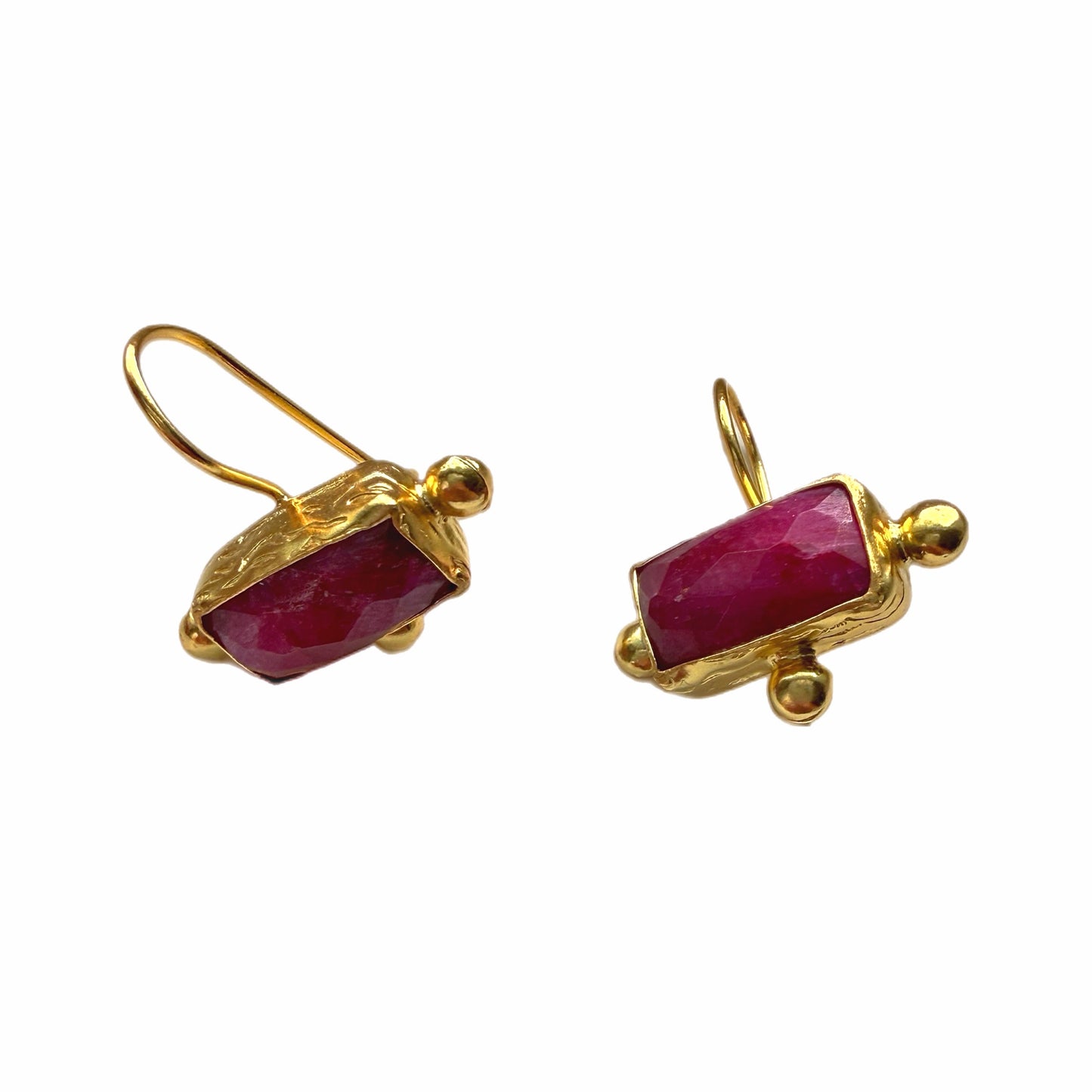 A pair of handmade rectangle gold ruby earrings on a plain white background.