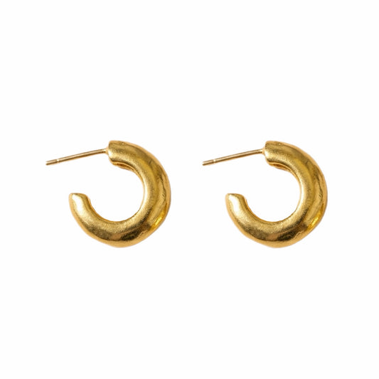Handmade gold-plated Huggies on white background