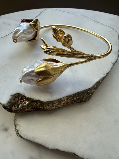 Handmade Gold-plated cuff bangle with floral design and baroque pearls 