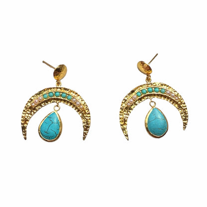 A pair of handmade gold-plated crescent horn drop earrings with small turquoise and pearl gemstones and a larger teardrop turquoise stone hanging below