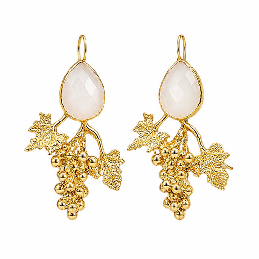 A pair of gold grape cluster drop earrings with teardrop-shaped milky white stones at the top, set against a plain white background.